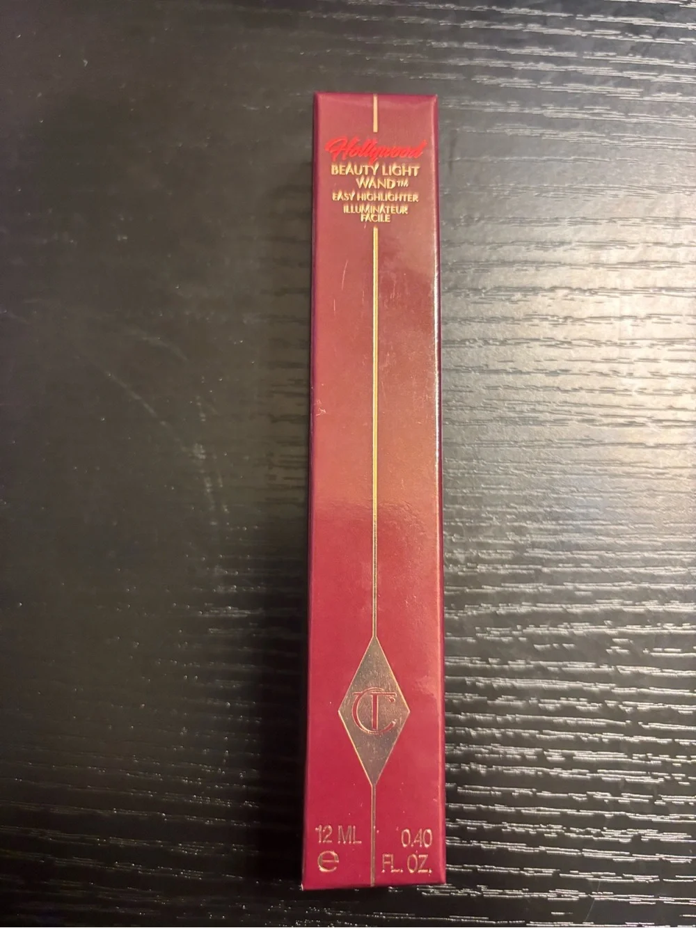 Charlotte Tilbury Beauty Light Wand Highlighter - Burgundy with Gold Accents
